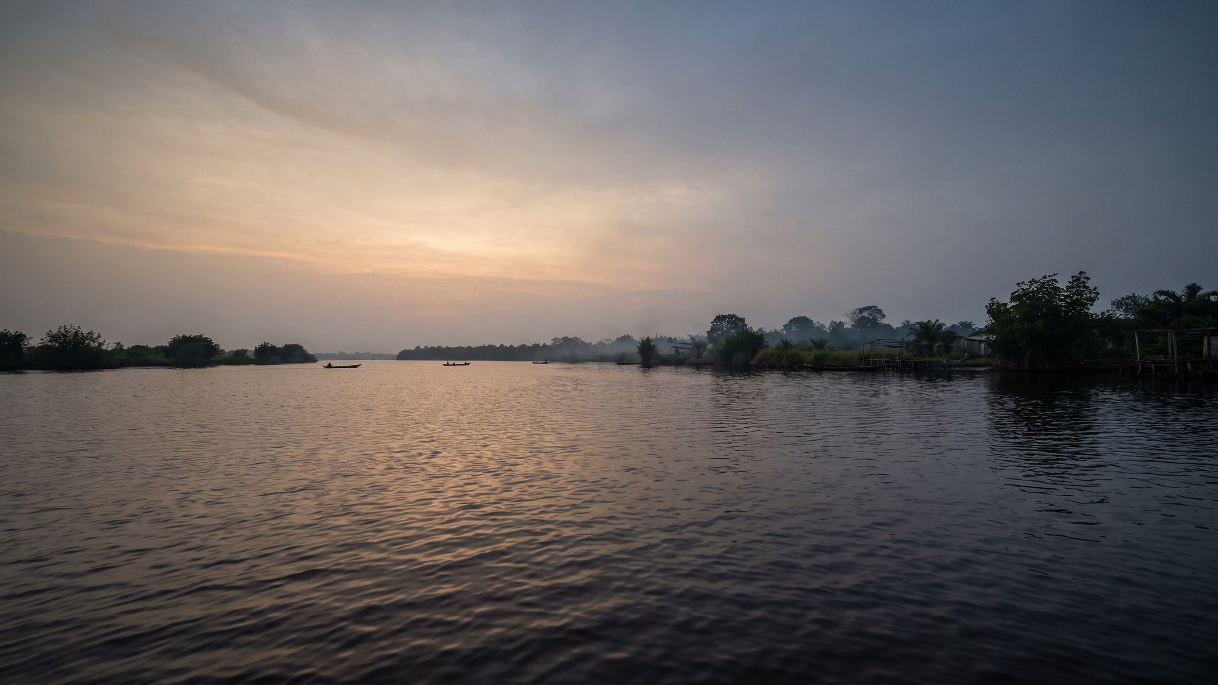 Niger Delta waterway at dusk.