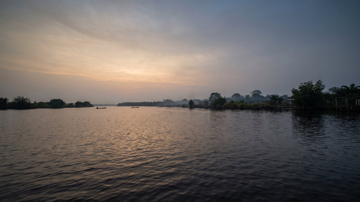 Niger Delta waterway at dusk.
